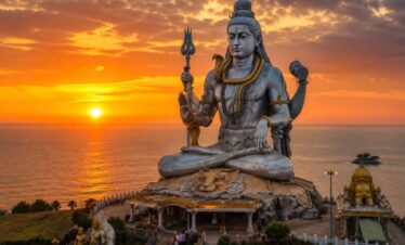 The colossal Lord Shiva Statue at Murudeshwar against the sunset.
