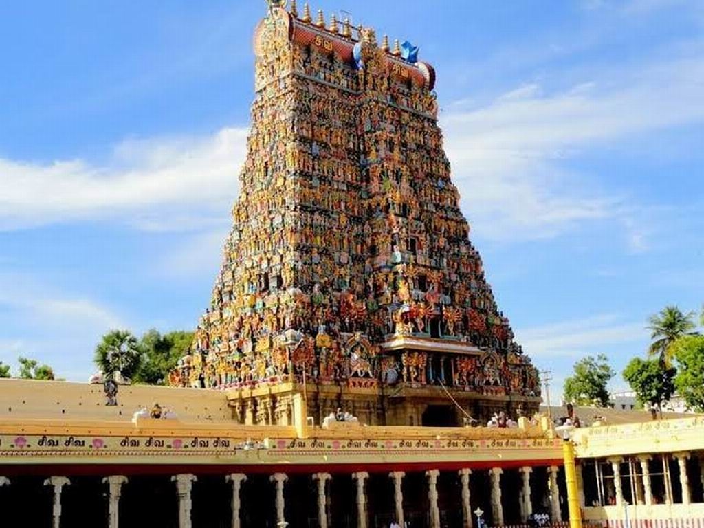 The Meenakshi Amman Temple. The towering, colorful Gopurams covered in thousands of stone figures are the signature look of Madurai.